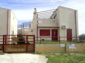 nemhouses near the airport and the sea in artemida